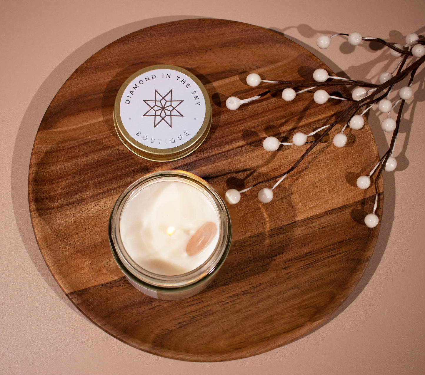 spa day candle resting on wood