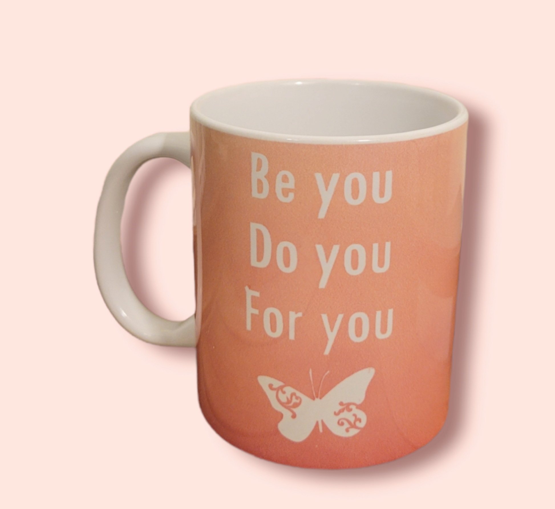 Pink 11 oz ceramic coffee mug that says be you do you for you