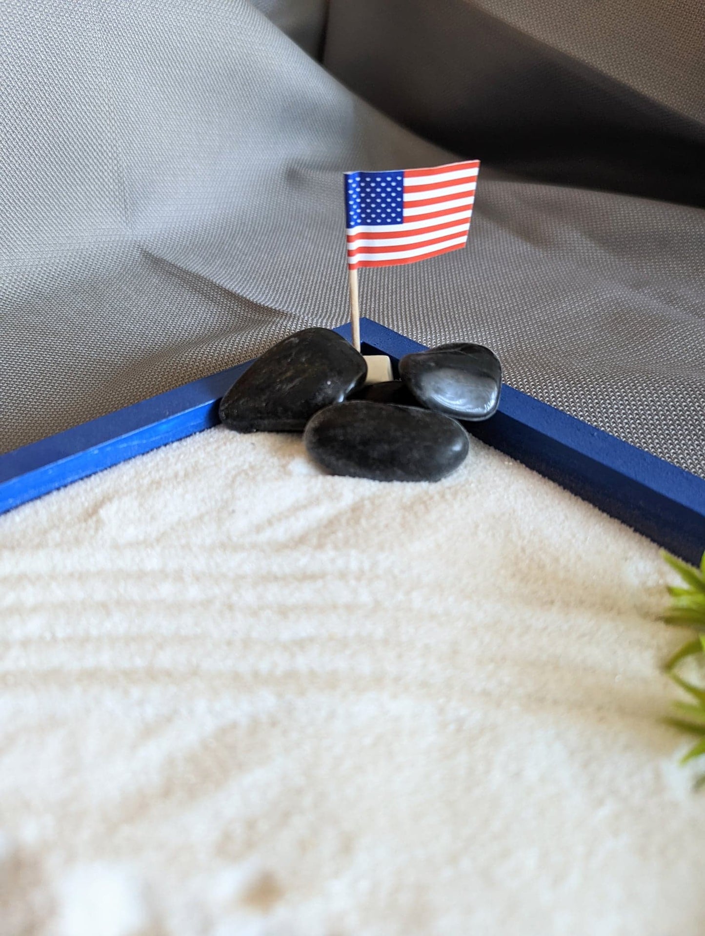 Blue 8"x8" miniature zen garden tray filled with sand and styles with accents.