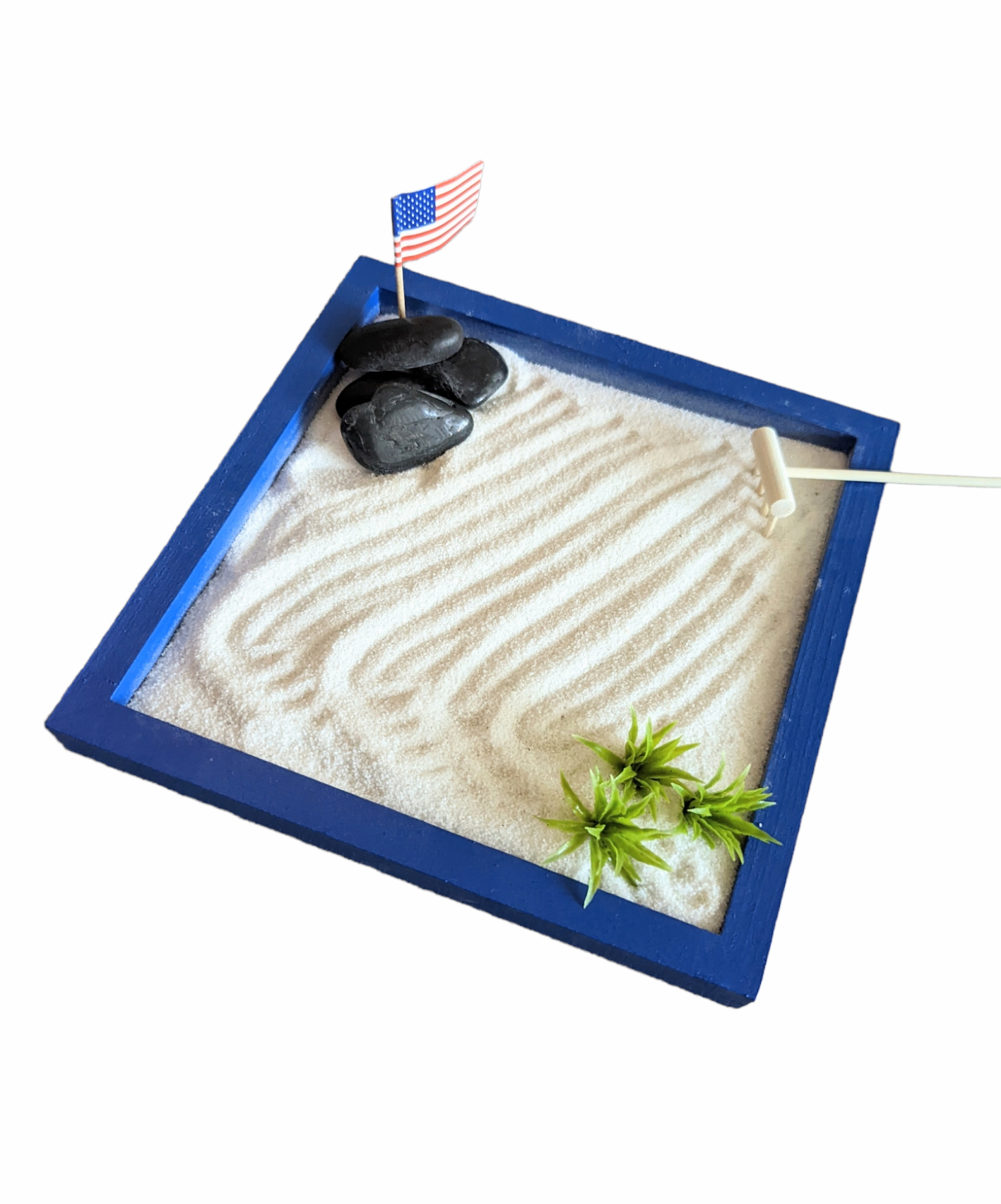 Blue 8"x8" miniature zen garden tray filled with sand and styles with accents.