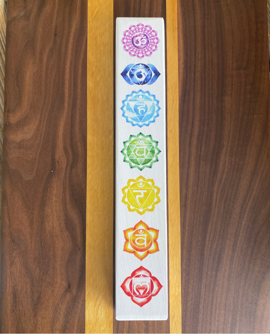 Slim and long white chakra sign with 7 images