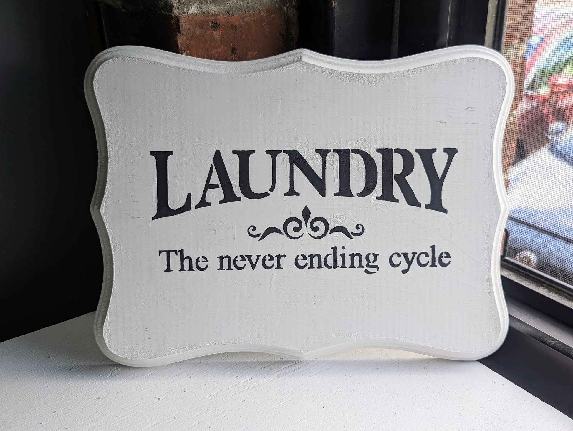 white laundry sign- laundry never ending sign