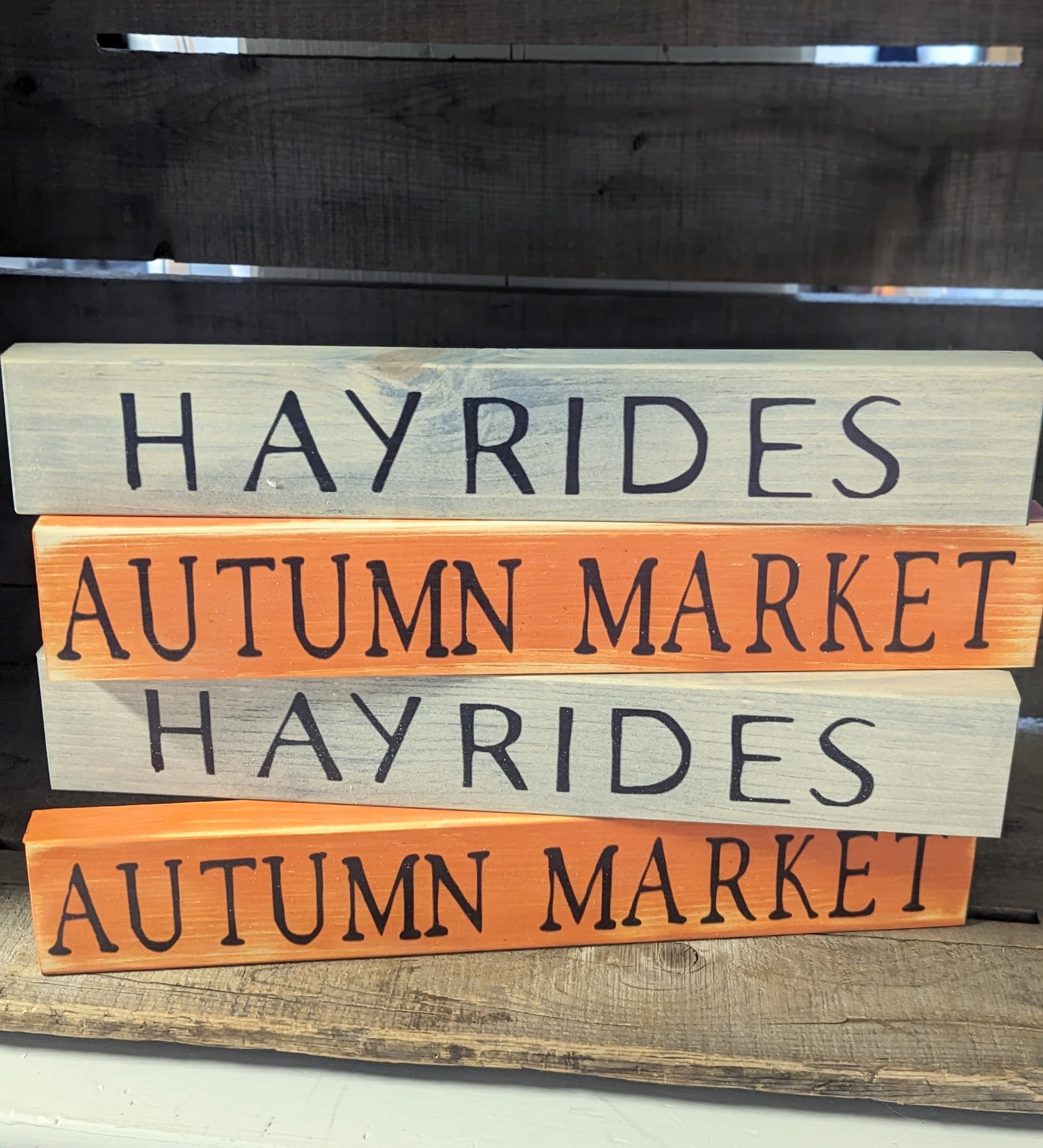 Photo of stacked fall signs grey and orange