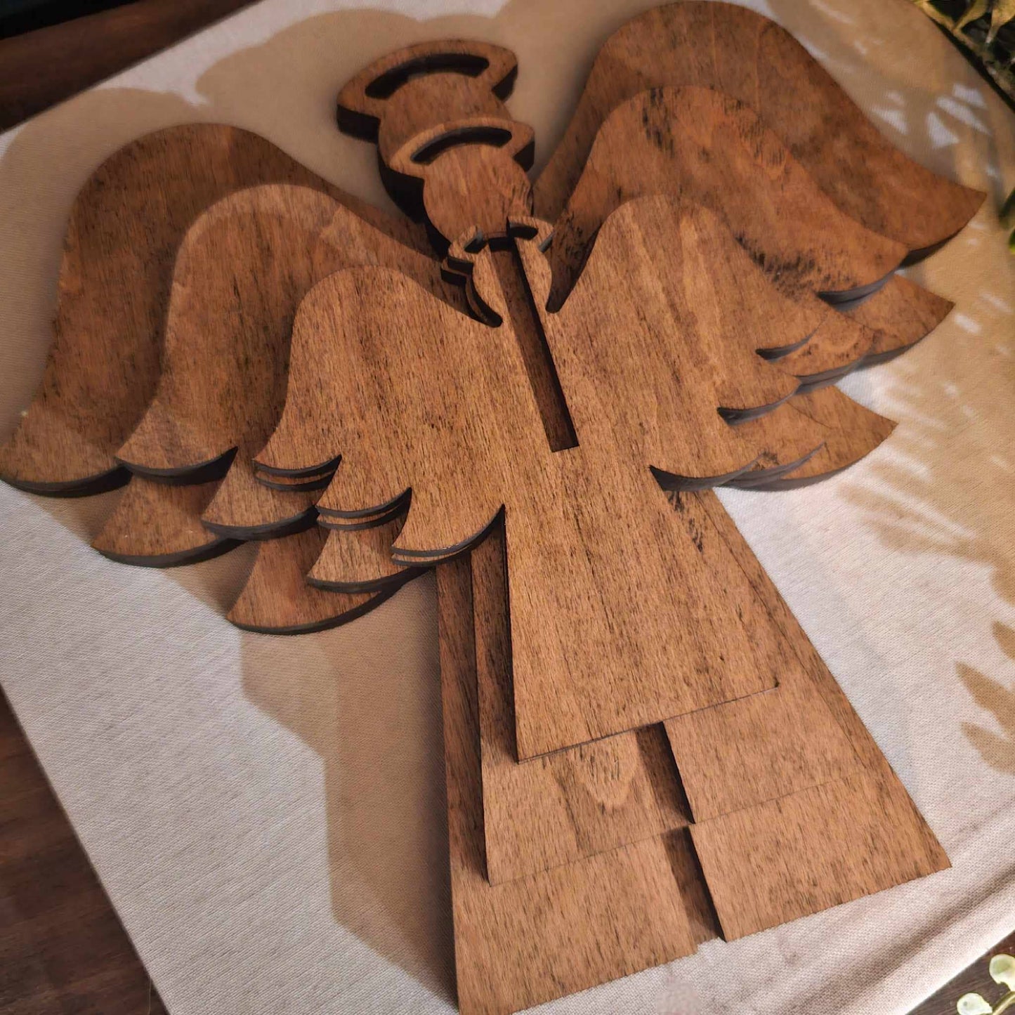 3d wood angels laying flat for easy storage