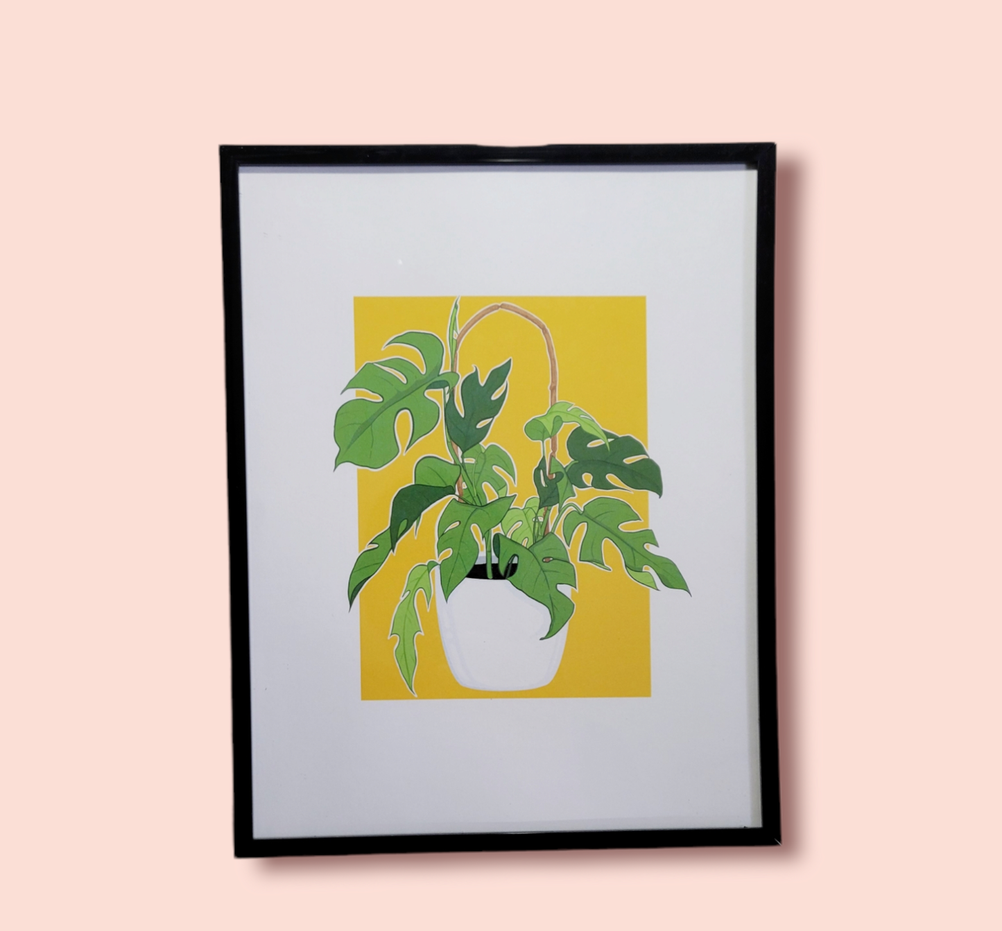 yellow background plant art print in black frame